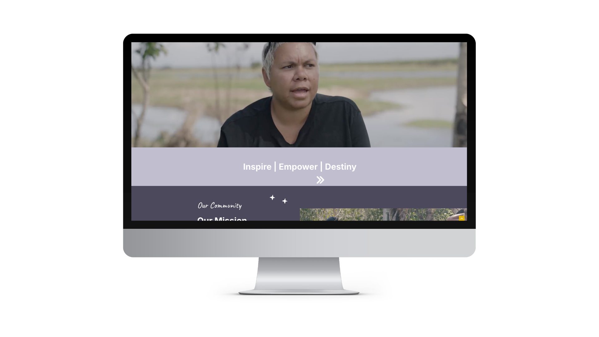 Desktop video hero: man in black shirt speaking outdoors, overlaid with banners reading 'Inspire | Empower | Destiny' on a lavender strip with a darker section underneath.