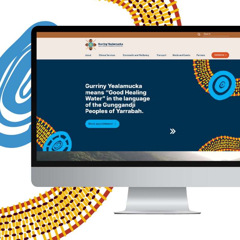 Desktop monitor showing a website hero with a navy panel describing Gurriny Yealamucka and its meaning for Yarrabah's Gunggandji Peoples.